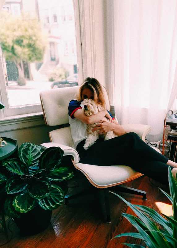 Woman and dog inside cozy home