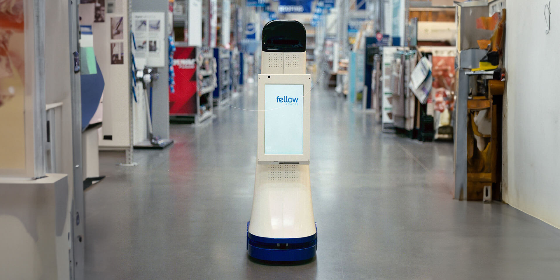LoweBot in an aisle of a Lowe's Home Improvement store.