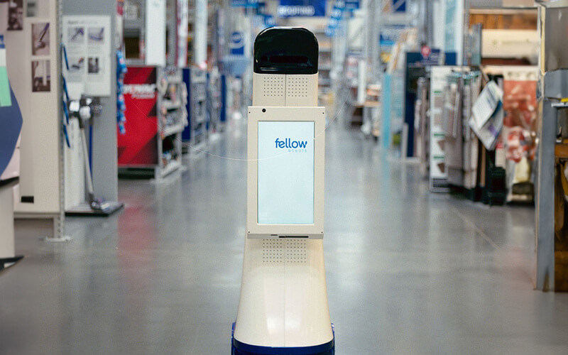 LoweBot in an aisle of a Lowe's Home Improvement store.