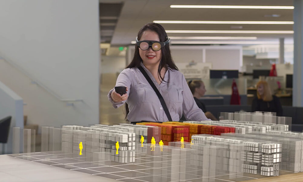 Woman wearing MagicLeap2 AR Headset viewing a simulated 3D store experience.